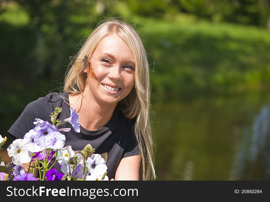 Girl with dragonfly, flowers on a natural green background. Girl with dragonfly, flowers on a natural green background