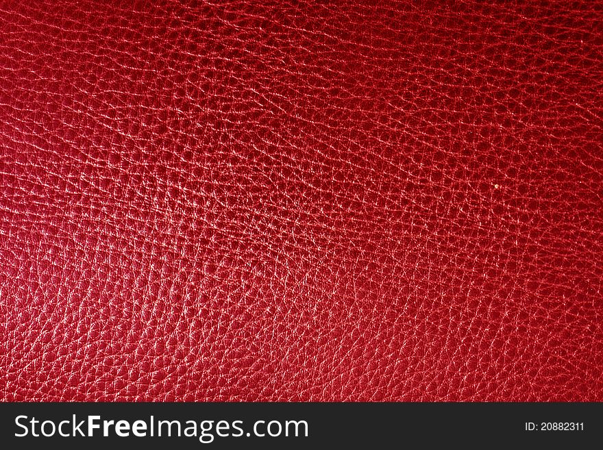Red leather texture closeup. Useful as background for design-works. Red leather texture closeup. Useful as background for design-works.