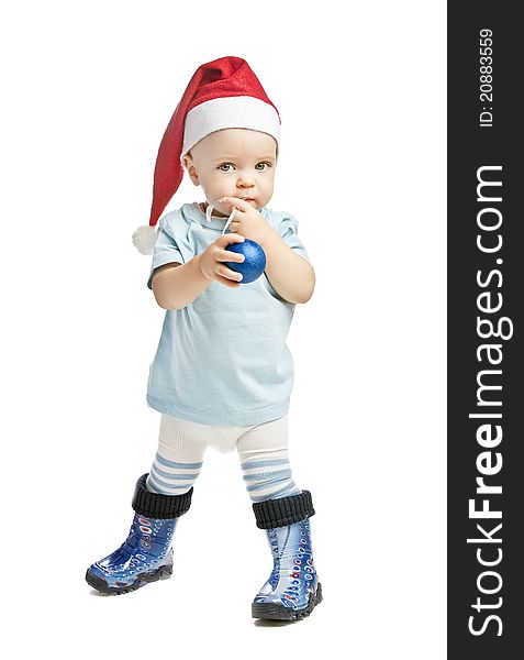 Caucasian baby boy in a red christmas cap isolated