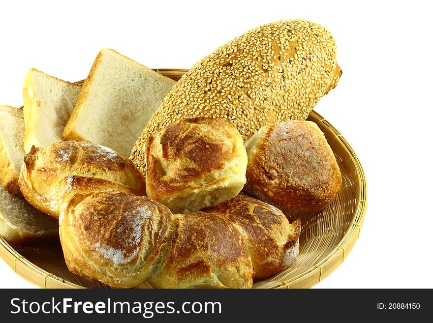 Stack of sliced whole wheat bread on isolated white background.