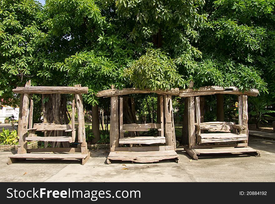 Three chair swing under trees. Three chair swing under trees