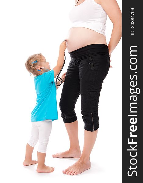 Child with stethoscope listening pregnant belly. Child with stethoscope listening pregnant belly