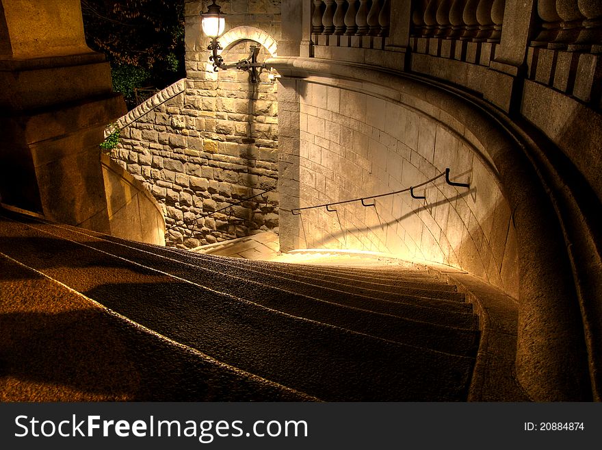 A steep staircase down into a dark night. A steep staircase down into a dark night