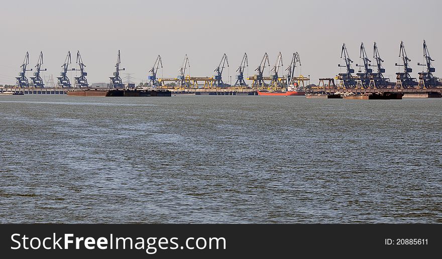 Shipyard cranes on Danube river in Galati city of Romania near Danube delta