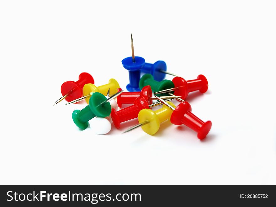 A heap of colorful pins on white background. A heap of colorful pins on white background