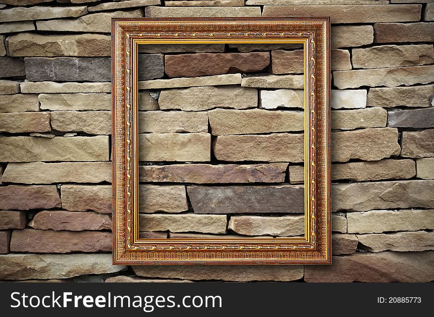 Golden Frame On Old Brick Wall