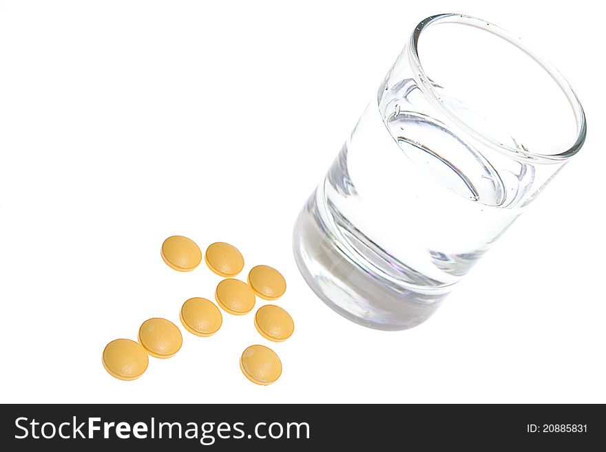 Glass of Water and Pills on white background