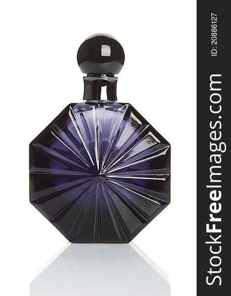 Close-up of dark blue bottle of perfume. Isolated. Close-up of dark blue bottle of perfume. Isolated