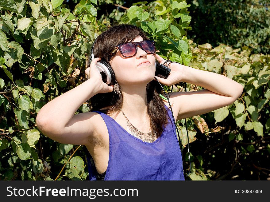Girl listening music in headphones. Girl listening music in headphones