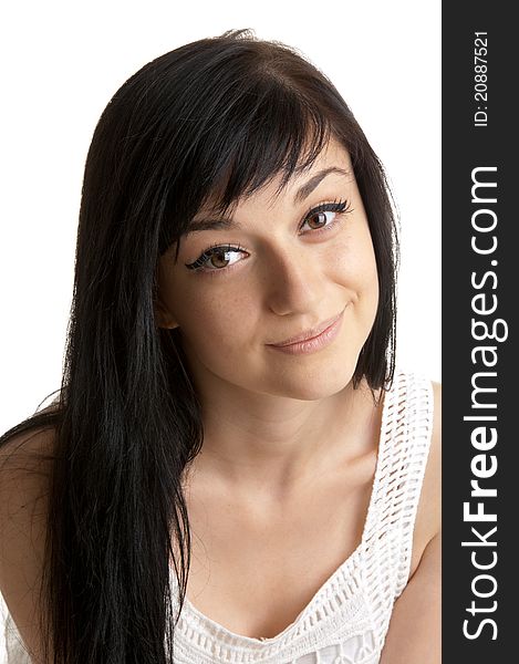 Beautiful brunette girl wearing a white dress on white background close-up