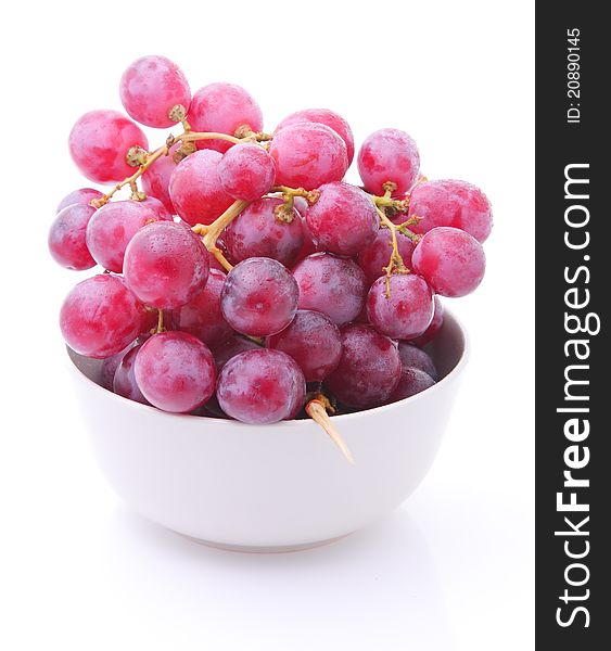 Image of red grape in bowl isolated over white