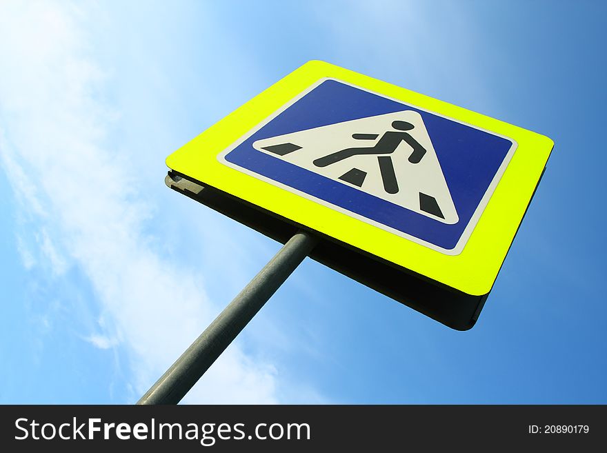 Image of pedestrian crossing sign against sky