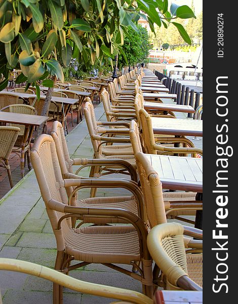 Image of street cafe with wicker chairs