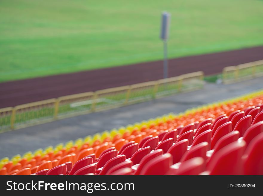 Emty tribunes with white sits and yellow steps on a soccer stadium. Emty tribunes with white sits and yellow steps on a soccer stadium