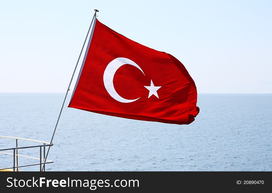 Image of Turkish flag over sea