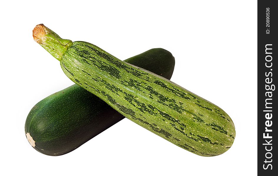 We see two green marrows isolated on the white background