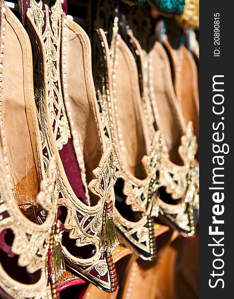 Rows of typically oriental shoes at the market in Dubai, shallow DOF.