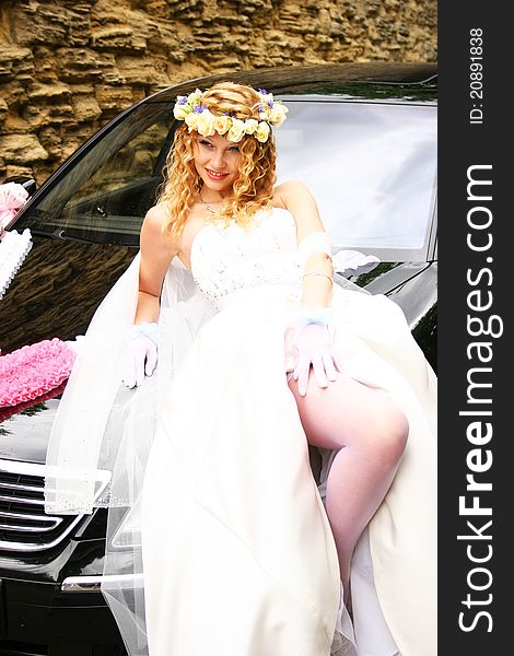 Bride Posing Near A Car