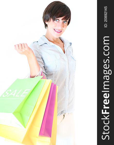 Beautiful young girl holding colorful shopping bags on sale. Beautiful young girl holding colorful shopping bags on sale