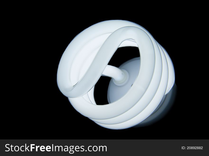 Compact fluorescent bulb on black background
