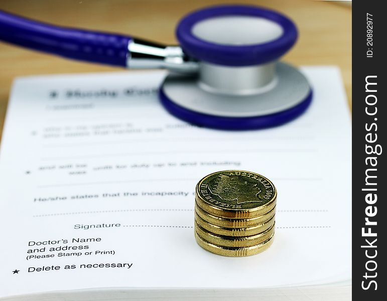 A doctorâ€™s desk showing a purple colored stethoscope stack of gold coins all resting on a sick certificate pad, suggesting the price of keeping healthy is rising. A doctorâ€™s desk showing a purple colored stethoscope stack of gold coins all resting on a sick certificate pad, suggesting the price of keeping healthy is rising.