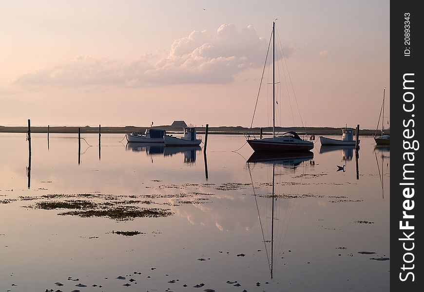 Magical sunset with boats reflection in the sea perfect sailing boating horizontal image. Magical sunset with boats reflection in the sea perfect sailing boating horizontal image