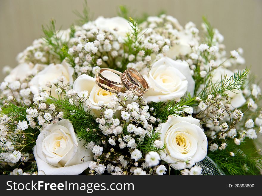 Wedding rings on a bridal bouquet. Wedding rings on a bridal bouquet