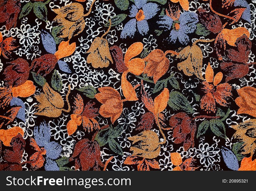 Background of old fabric with autumnal colors and flowers, leafs and ornaments. Background of old fabric with autumnal colors and flowers, leafs and ornaments