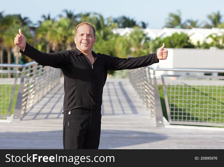 Image of a man showing two thumbs-up