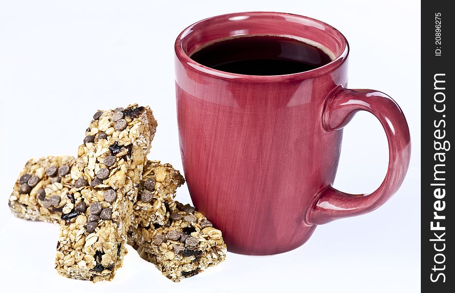 A cup of coffee with granola bars for breakfast. A cup of coffee with granola bars for breakfast