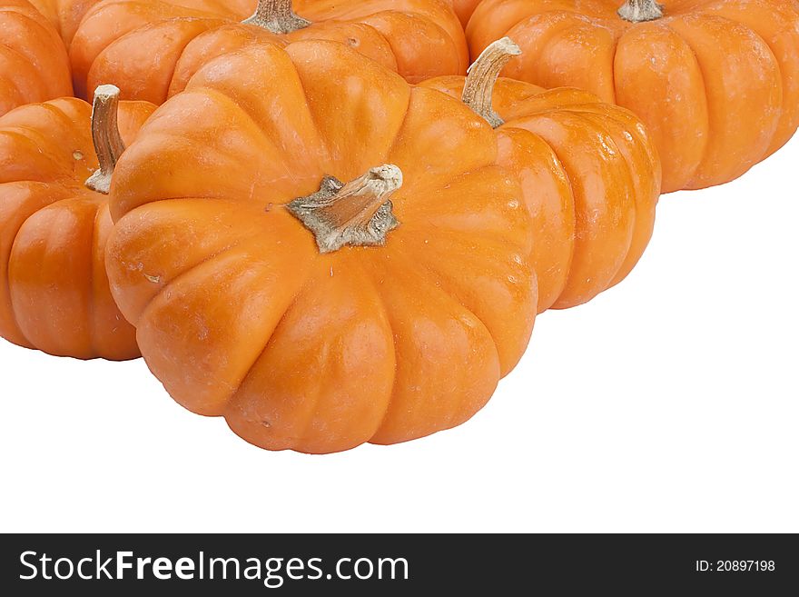 Small orange pumpkins symbolising autumn holidays and used in decorative works.