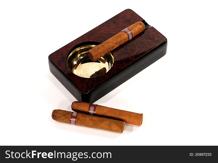 Cigars and varnished wooden ashtray. Cigars and varnished wooden ashtray