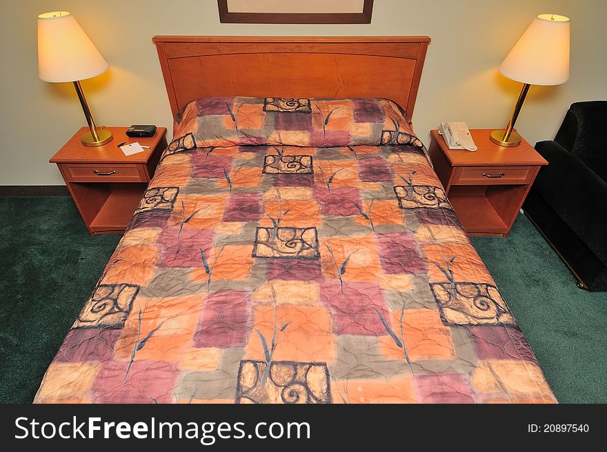 Large clean bed with lamps