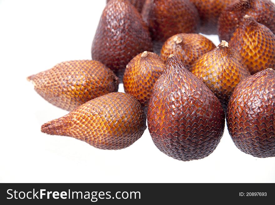 Isolated close-up zoom delicious exotic asian snake fruit food, as known as salak fruits. Isolated close-up zoom delicious exotic asian snake fruit food, as known as salak fruits.