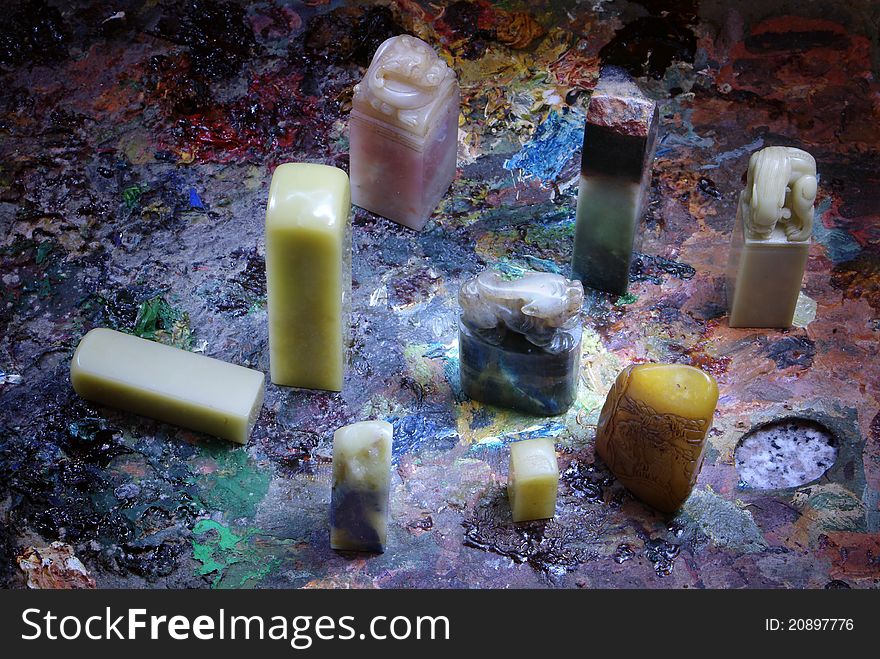 Traditional Chinese stone seals placed in a colorful background. Traditional Chinese stone seals placed in a colorful background