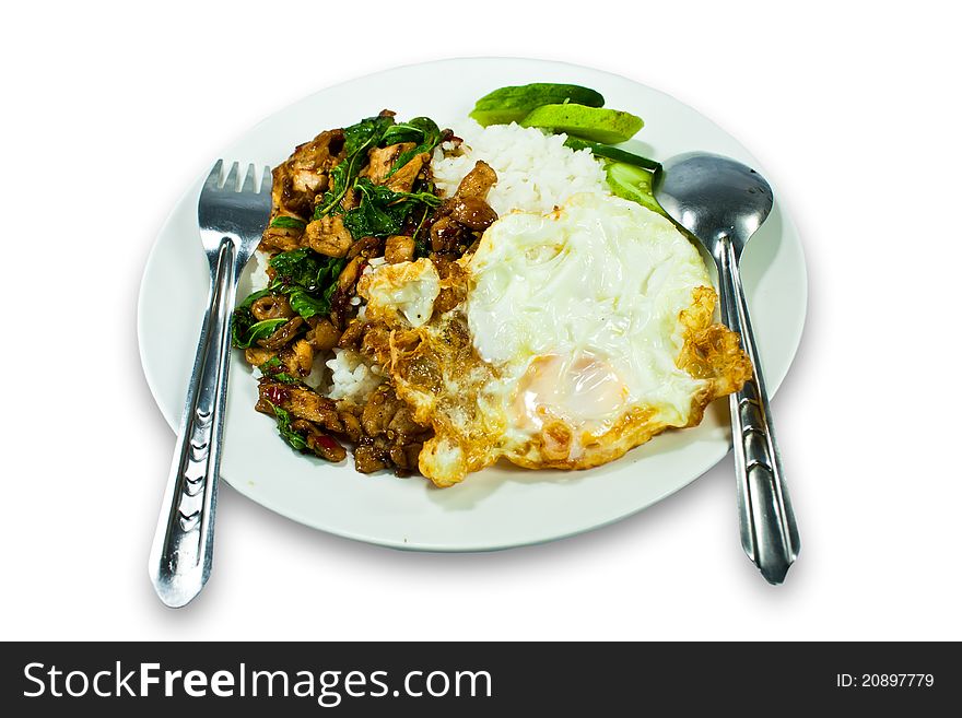 Stir fried Chicken with basil and egg served with rice. Stir fried Chicken with basil and egg served with rice