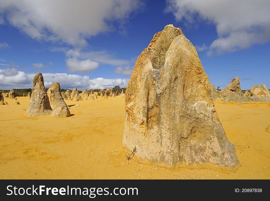 Hot and sandy desert in Australia with unique rock formations. Hot and sandy desert in Australia with unique rock formations.