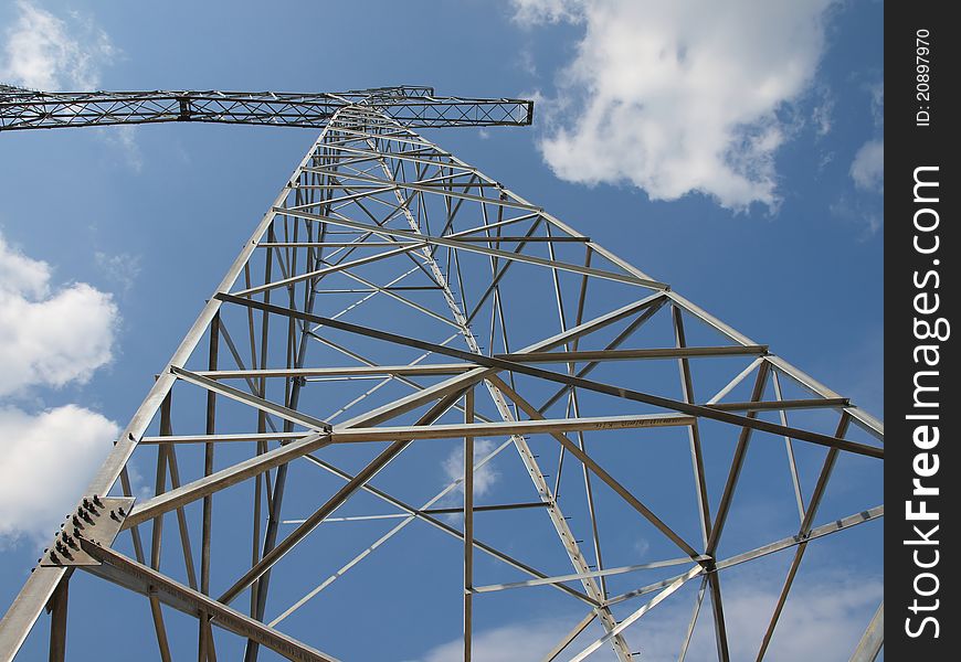 Electrical tower without wires against the blue sky