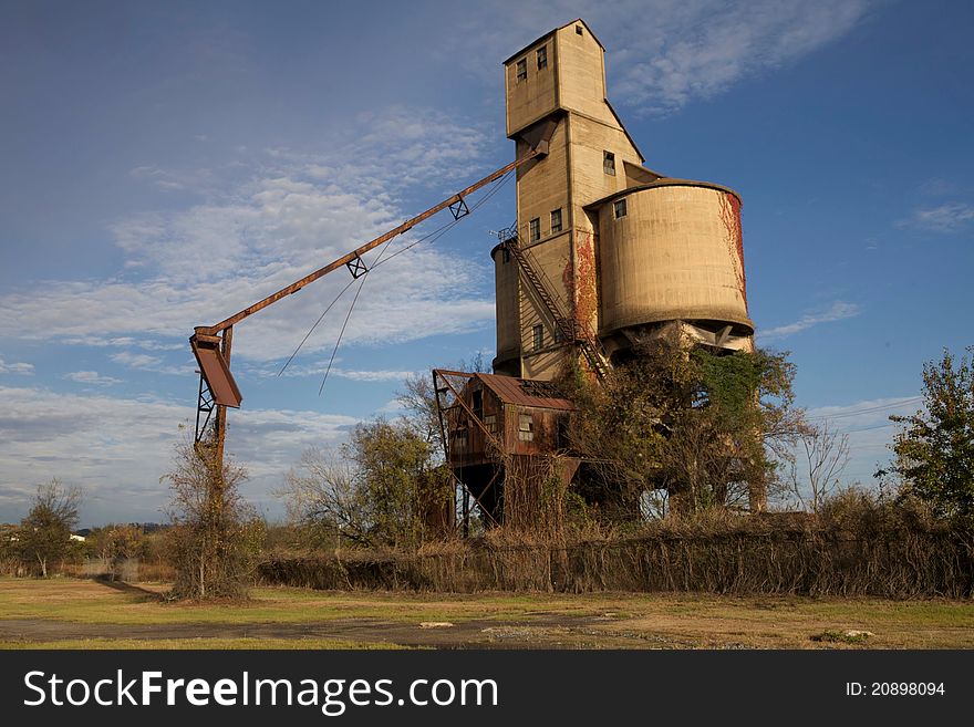 Old coal silo overgrown with weeds