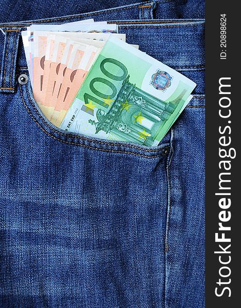 Euro banknotes in blue jeans pocket