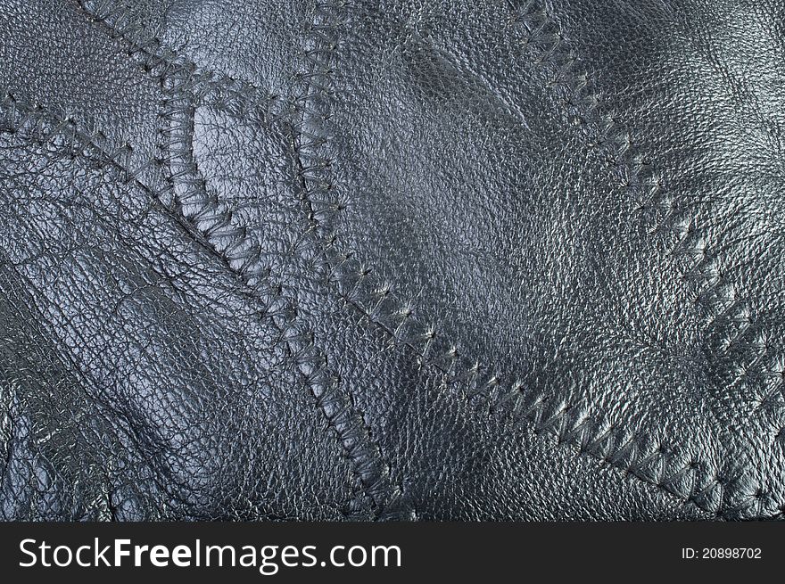 Black leather texture close-up. Black leather texture close-up.
