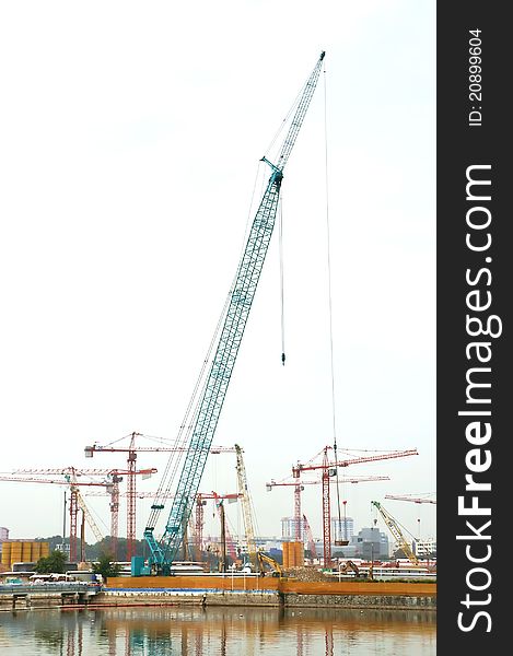 A Construction Site beside the river bank. A Construction Site beside the river bank