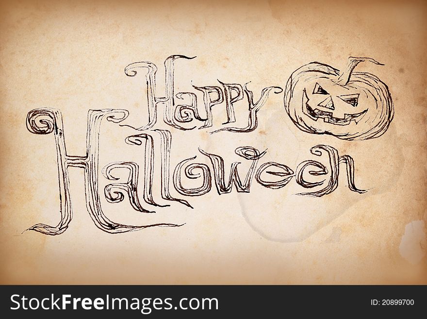 Hand writing à¹‡Halloween on old paper