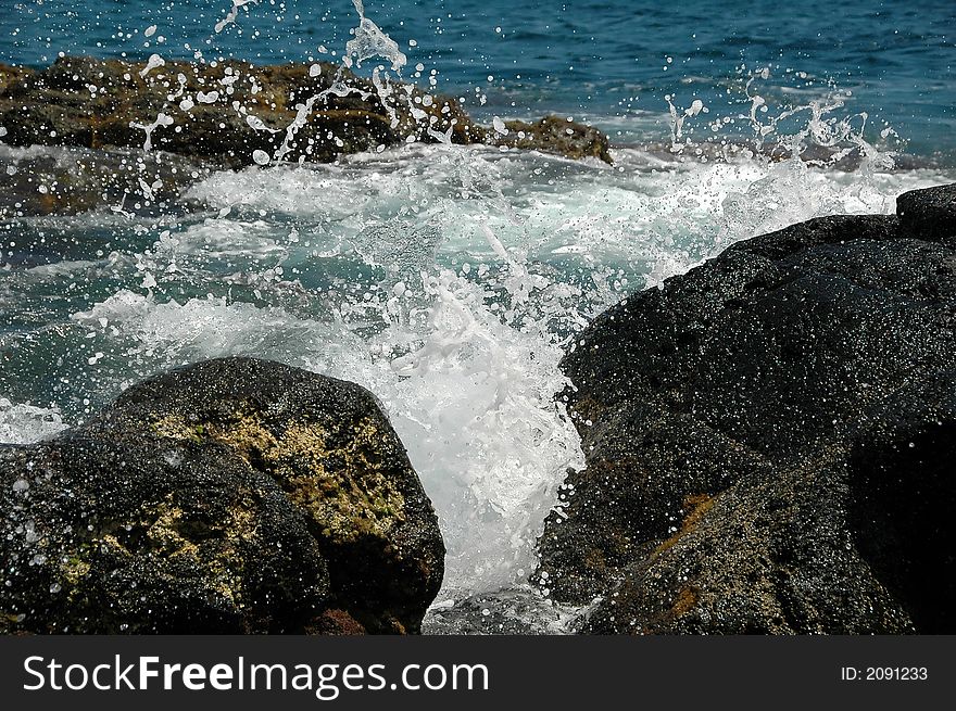 Ocean waves spraying against an Azores Island coastline. Ocean waves spraying against an Azores Island coastline