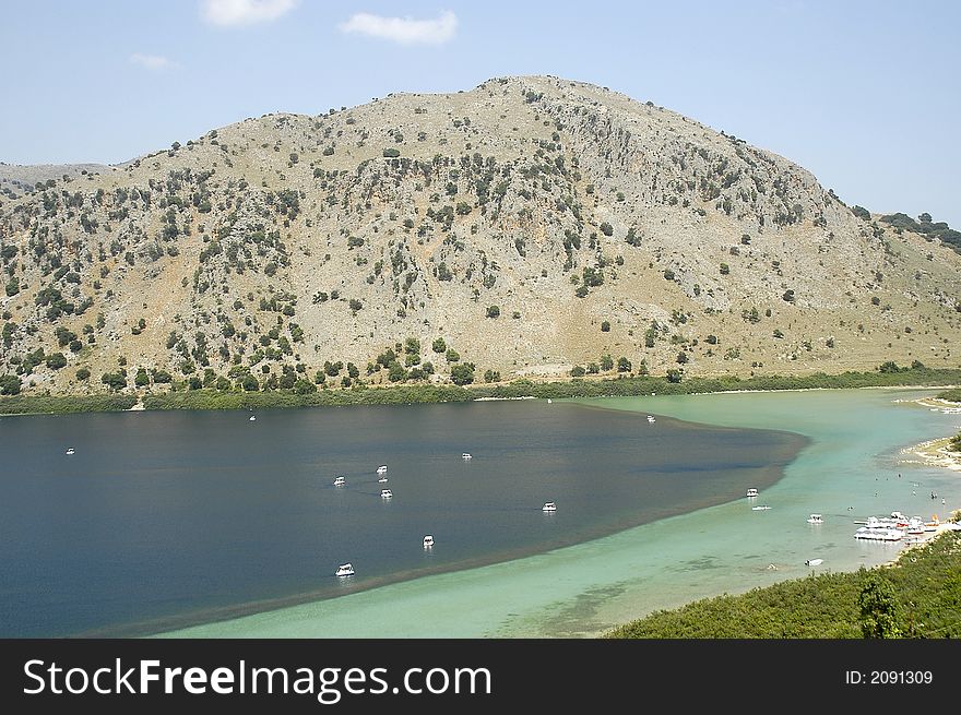 Crete Lake Kournas with sailing boats and mountain