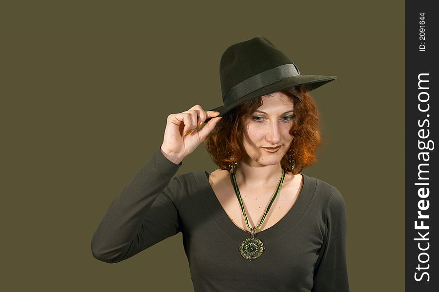 Red haired girl in a hat