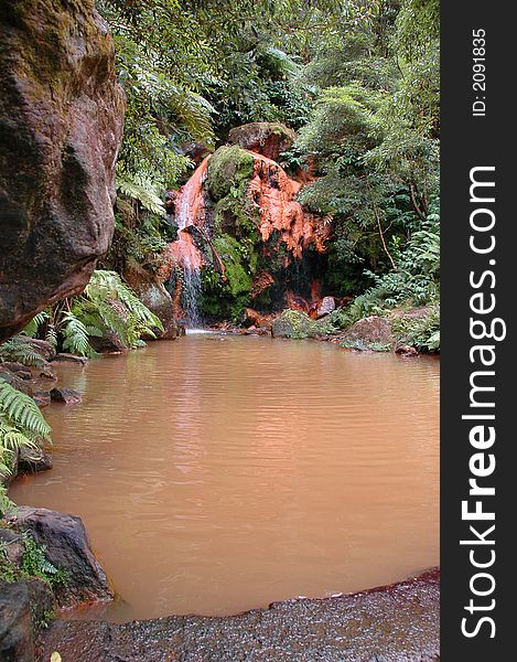 Exotic natural mineral pool in the Azores surrounded by forests. Exotic natural mineral pool in the Azores surrounded by forests