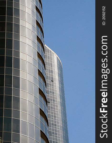 Modern skyscrapers against a bright blue sky