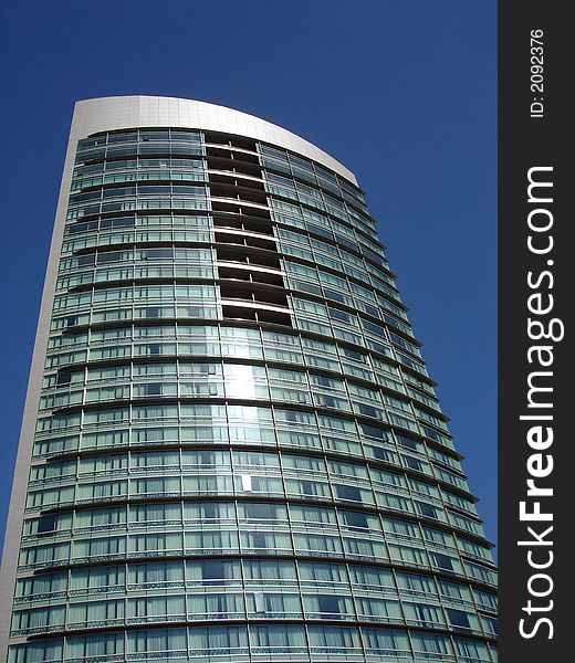 Modern skyscrapers against a bright blue sky