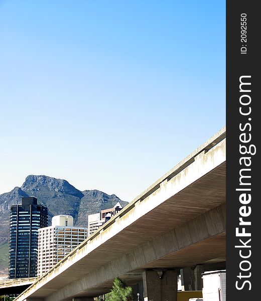 Portrait photo of a concrete overpass leading into Cape Town. Portrait photo of a concrete overpass leading into Cape Town